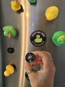 Refrigerator with ducks and Ducktion Cups stuck to it